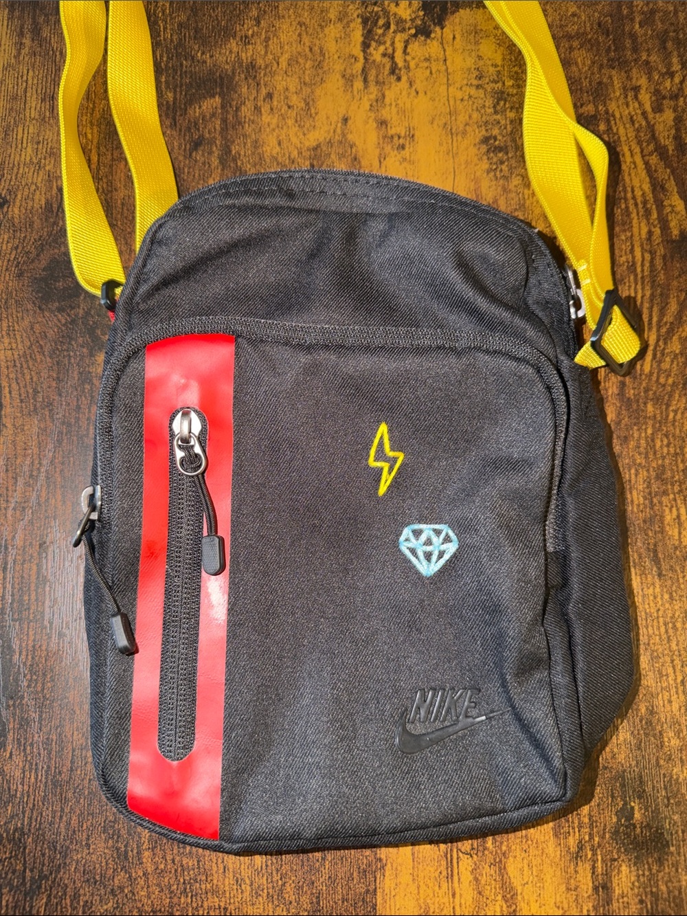 Nike Black Crossbody Bag with Yellow Strap and Red Accent